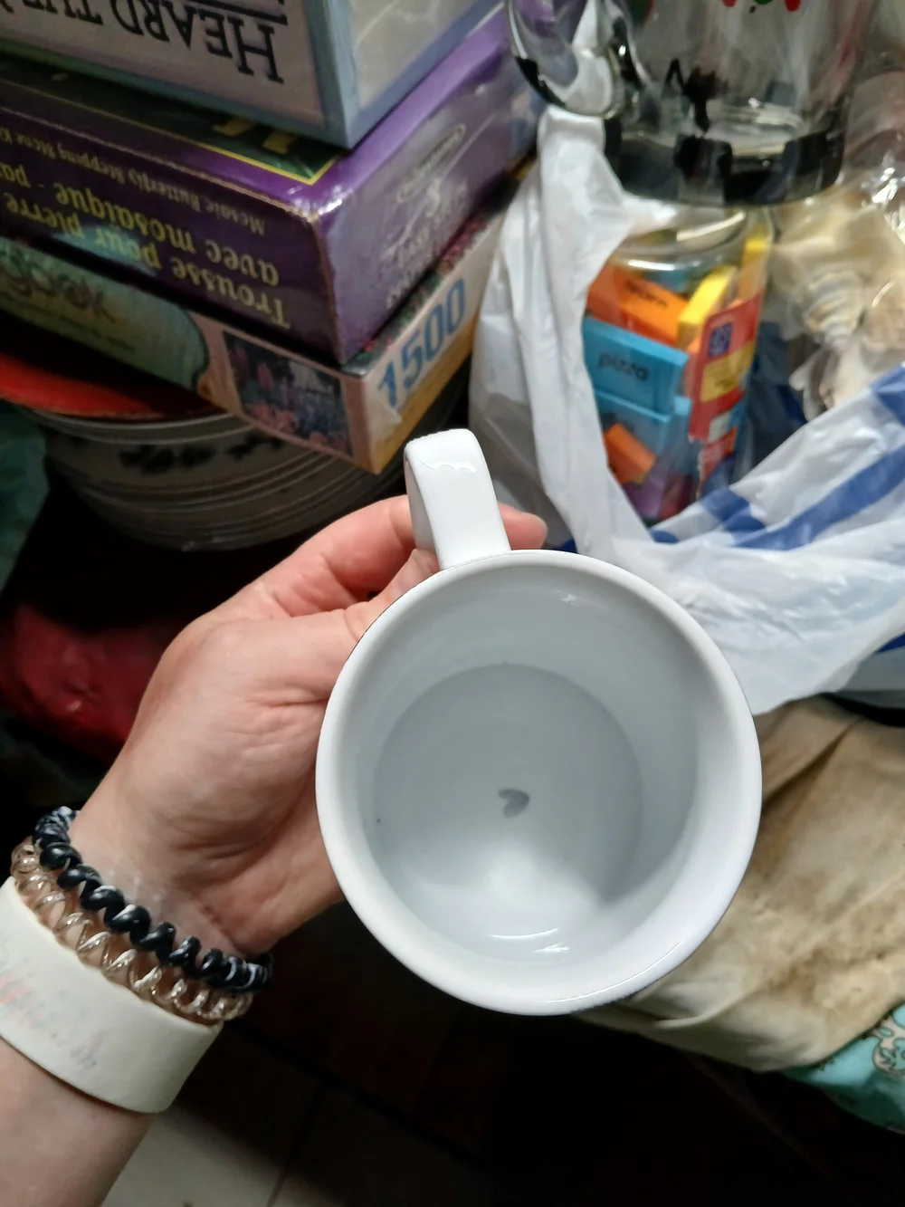 white Williams Sonoma ceramic mug features 